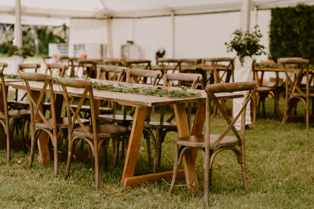 Rustic themed furniture set up for a backyard wedding on a rural property