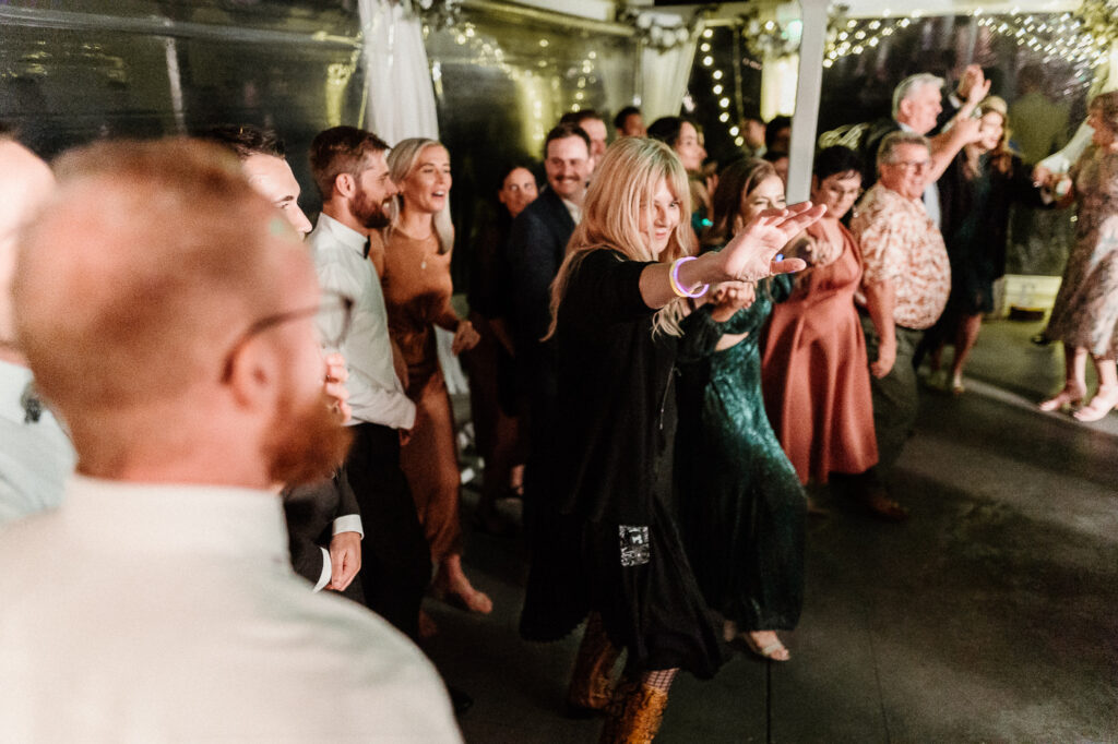 The guests dancing at a wedding